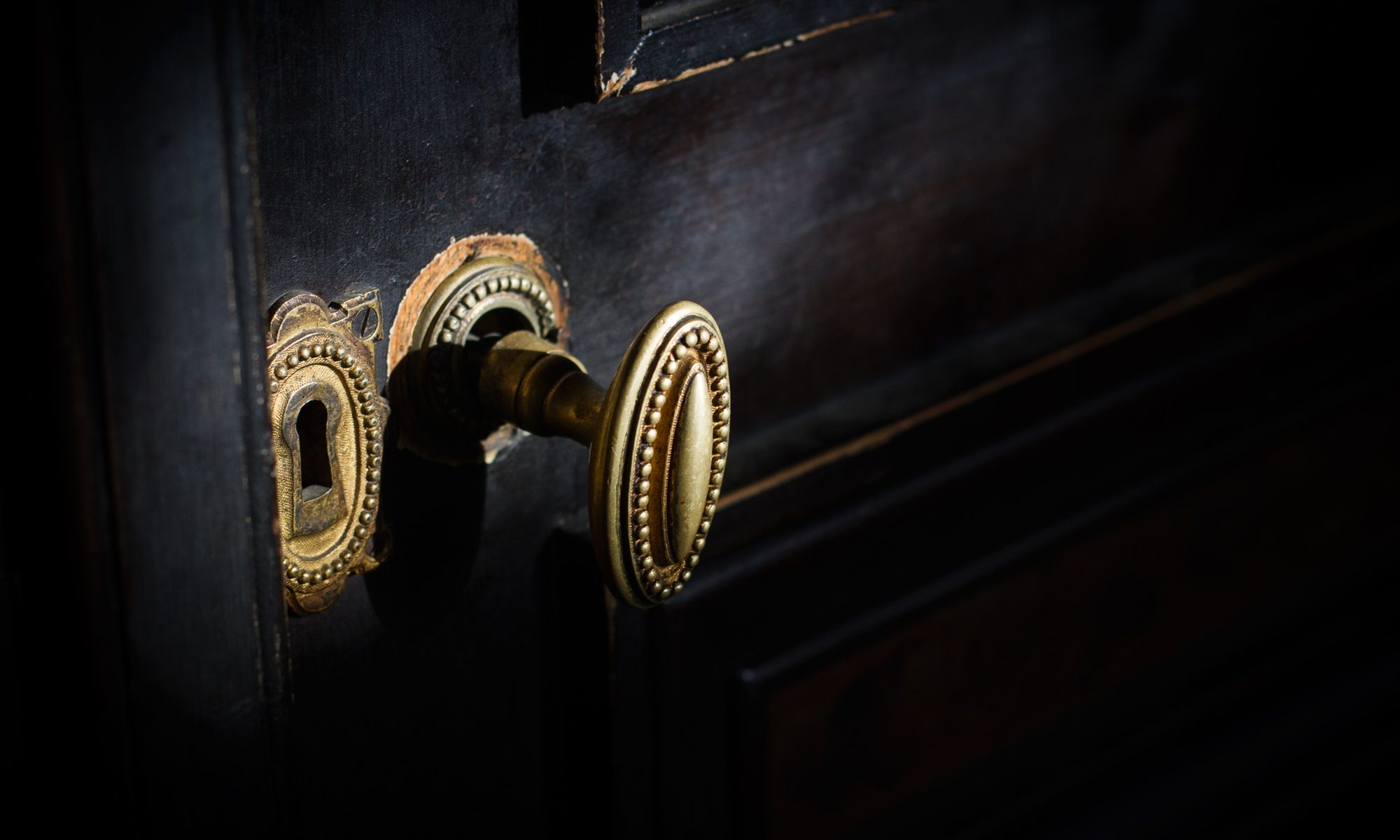 detail of antique golden door handle knob